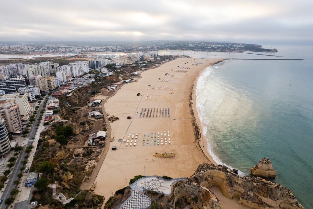 Aerial drone view of Portimao skyline and city beach of Praia da Rocha , Algarve,Portugal